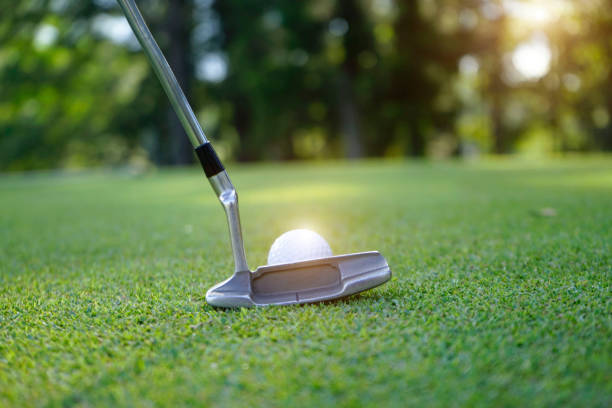 istock Golf ball and golf club in beautiful golf course 1303162155