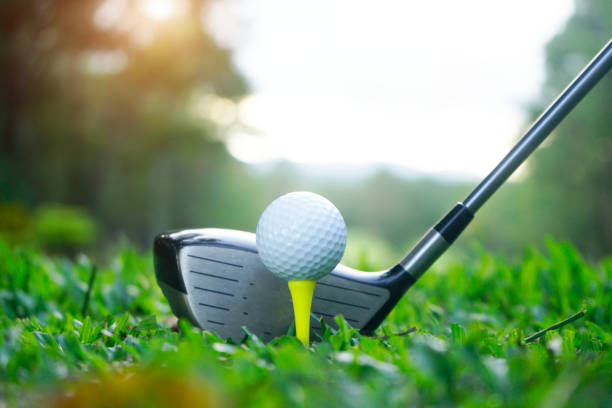 istock Golf ball and golf club in beautiful golf course 1303162162