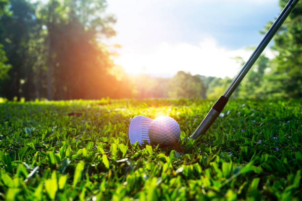 istock Golf ball and golf club in beautiful golf course 1303162214