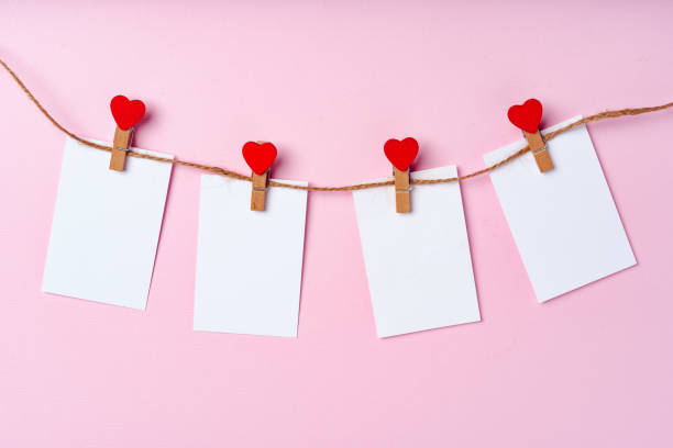istock Heart clothespins on rope. Creative background with copy space 1303162848