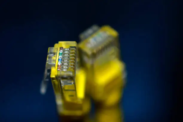 Yellow RJ-45 or ethernet internet cable close-up