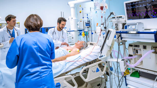 istock Examining and talking with patient in Intensive care unit 1303165249
