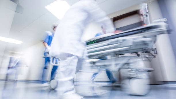 istock Wheeling hospital stretcher with patient 1303165281