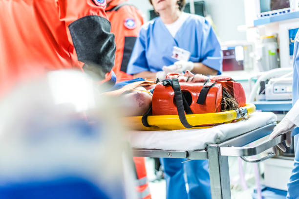 istock Patient immobilised on stretcher during handing over into emergency ward 1303165293