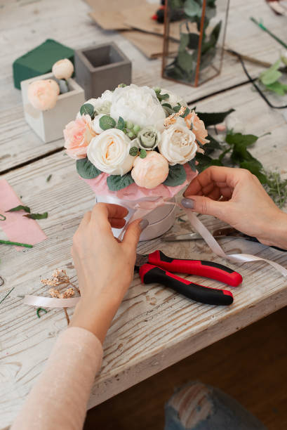 istock Master class on drawing up bouquets. Summer bouquet. A bouquet of decorative flowers. Artificial flowers. 1303165709