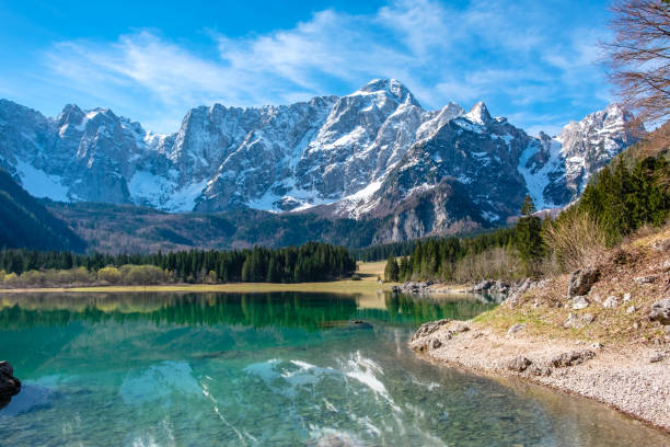 istock Spring morning at the alpine lake 1303165741