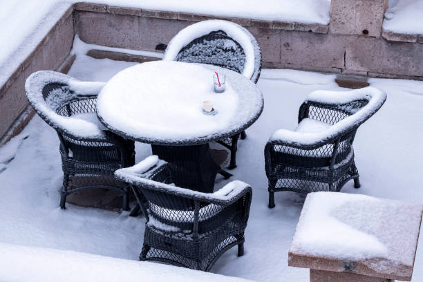 istock Table, empty chairs, empty juice glass and empty coffee cup under the snow at Cappadocia 1303166805