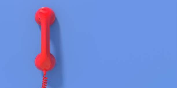 istock Vintage telephone, red old phone handset on blue wall background, copy space. 3d illustration 1303169349