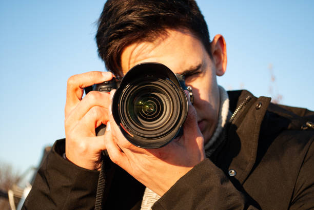 istock Young attractive photographer in nature. 1303169461