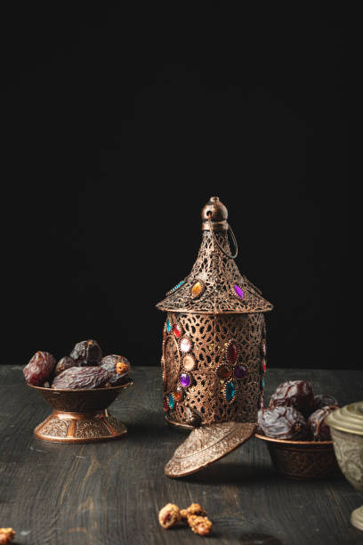 istock Ramadan concept with lantern and plate of dried dates 1303170483