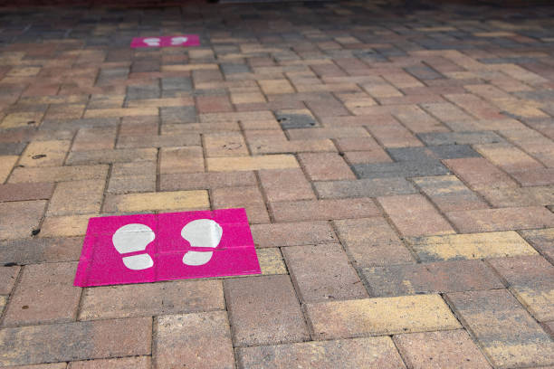 istock Social Distancing Footprint Signs 1303171825