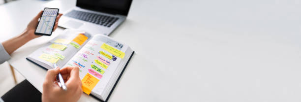 istock Businessperson Writing Schedule In Diary 1303171915