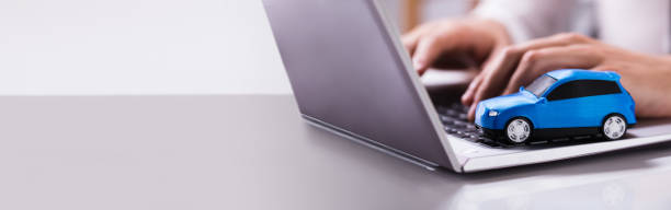 istock Blue Car On Laptop Keypad 1303171938