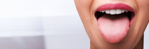 istock Woman Showing Tongue 1303173033