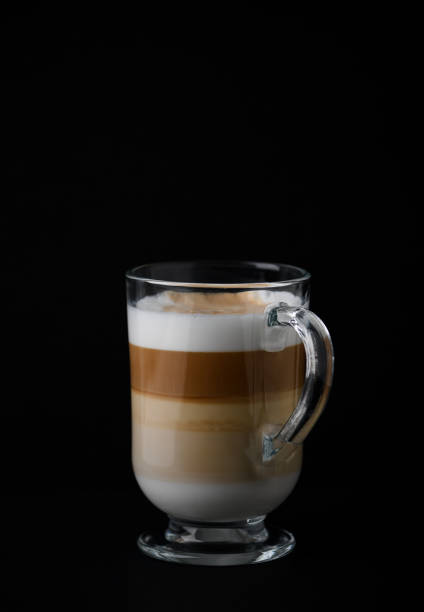 istock Coffee with milk on dark background. Close up. Copy space. 1303174634