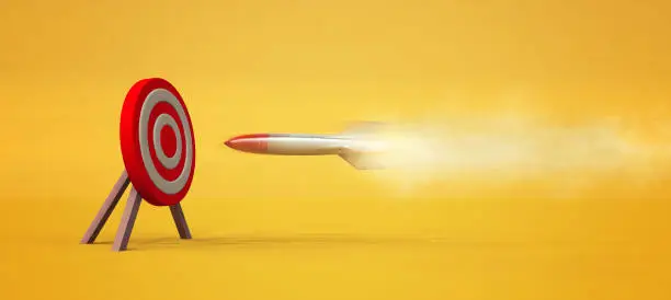Photo of Rocket to a red target . Target audience concept . Powerful marketing strategy . This is a 3d render illustration .