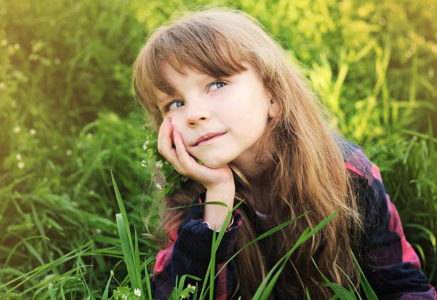 istock Little girl has fun in the park 1303174883