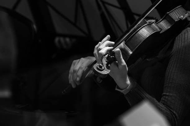 istock Hands of a musician playing the violin 1303174976