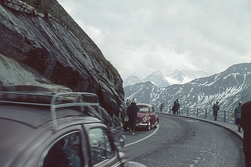 Swiss Alps, 1962. Alpine road with tourists in Switzerland.