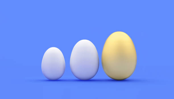 istock A row of whites and one gold egg on blue. 1303175218