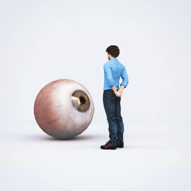 istock Man looks at a oversized eye . Recruiting concept . This is a 3d render illustration . 1303175229