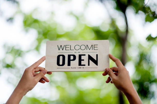 istock Hand and sign store opening 1303175949