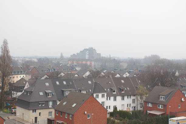Aerial view over Duisburg South  at dusty sky
