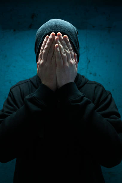 istock Homeless depressed man with hands over face in despair 1303181531
