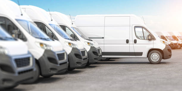 istock Delivery vans in a row with space for logo or text. Express delivery and shipment service concept. 1303181810