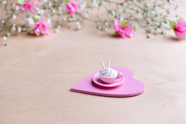 Miniature cup and plate made of pink polymer clay with marshmallow and waffle tube. Miniature cup and plate made of pink polymer clay with marshmallow and waffle tube. Greeting card with flowers for Women's Day. polymer clay sweets stock pictures, royalty-free photos & images