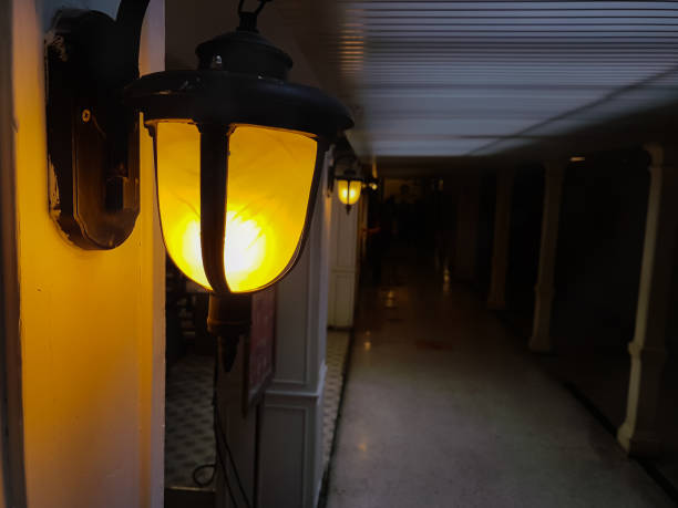 istock An old lamp spreading light to give the corridor a scary atmosphere 1303184174