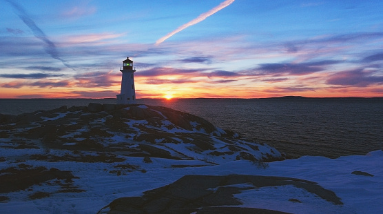 Peggy's Cove Lighthouse in sunset light. February 2004.