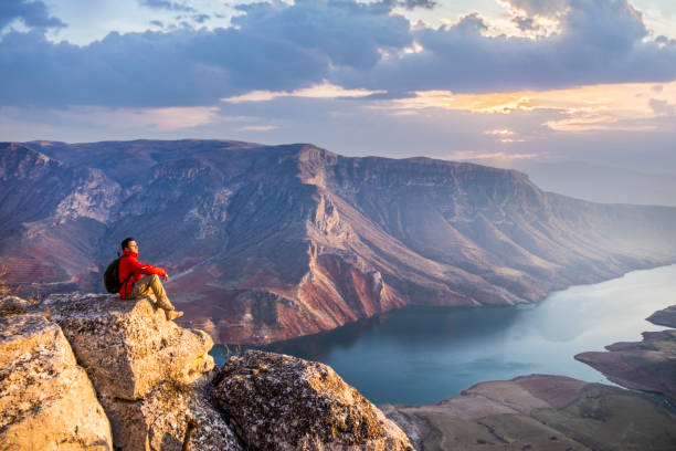 istock Climber watching the view on the top of cliff 1303185019