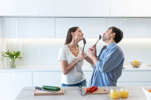 istock Cheerful couple having fun in the kitchen 1303187311