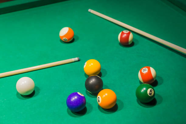 istock Billiard balls on pool green table 1303189905