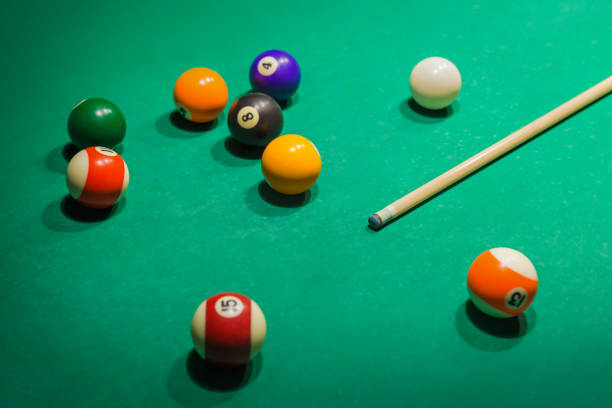 istock Billiard balls on pool green table 1303189930