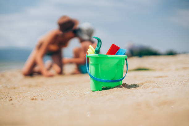 istock Beach toys in the sand. 1303193881