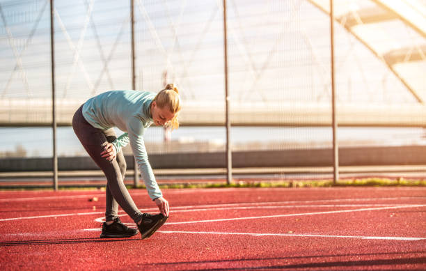 istock Young woman stretching. 1303193993
