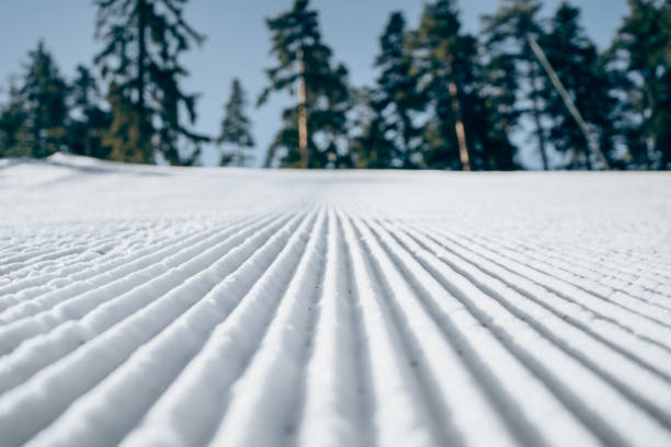 Empty ski slope. Empty ski slope with fresh snow on a sunny day. Snowmobiling stock pictures, royalty-free photos & images