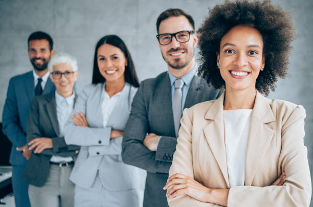 istock Confident businesswoman and her team. 1303194335
