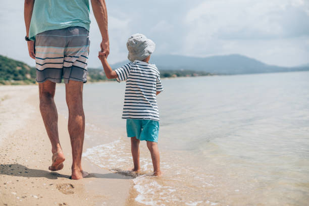 istock Father and son on the beach. 1303194362