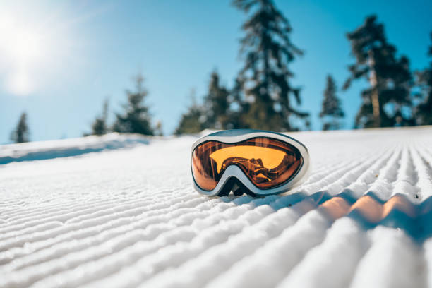 istock Ski goggles on the snow in the mountain. 1303194363
