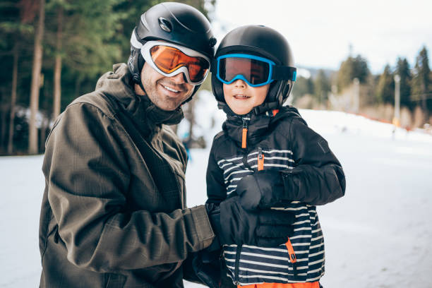istock Father and son on winter vacation in the mountain. 1303194366