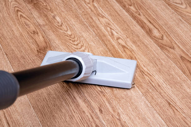 istock Vacuum cleaner brush on a wooden floor 1303194442