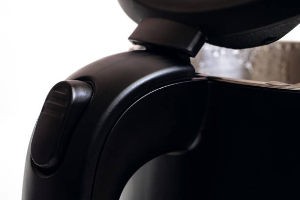 istock Electric kettle lid opening button close up 1303194524