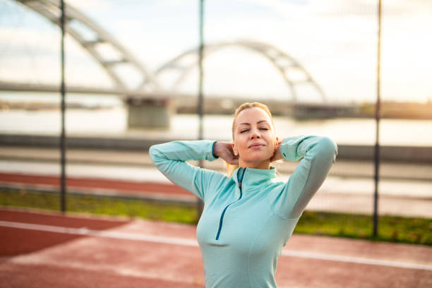 istock Mid adult woman getting ready for training. 1303195633
