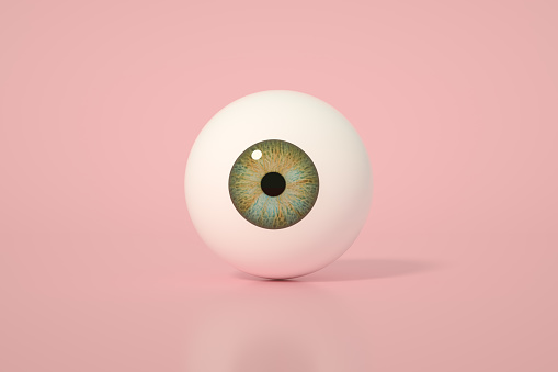 3d rendering of glossy eyeball, eye iris on pink background.