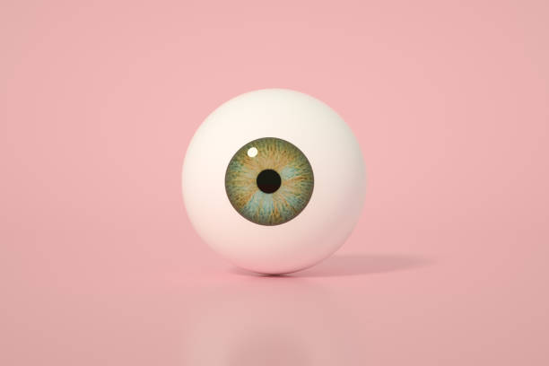 глянцевое глазное яблоко, радужная оболочка глаза на розовом фоне - хрусталик иллюстрации стоковые фото и изображения