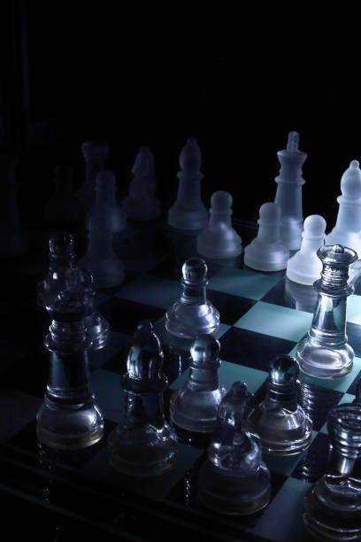 istock chess pieces made of glass in low light 1303200541