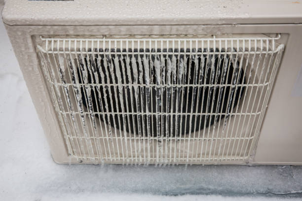 istock Mini split air conditioning outdoor unit covered in ice from winter storm 1303201786